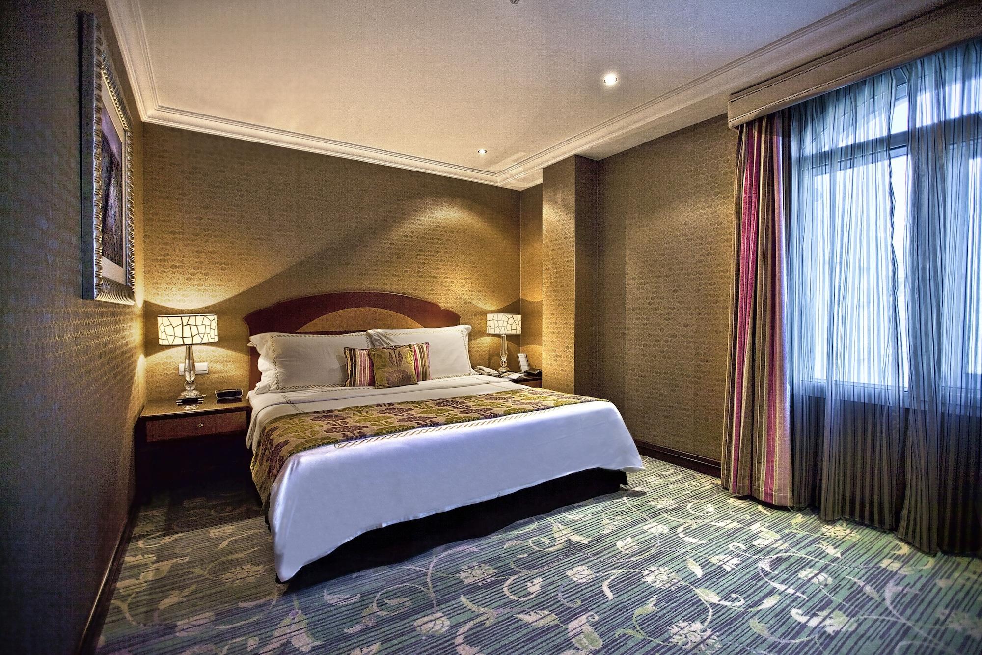 Grand Regency Doha, Trademark Collection By Wyndham Dış mekan fotoğraf A bedroom at the hotel